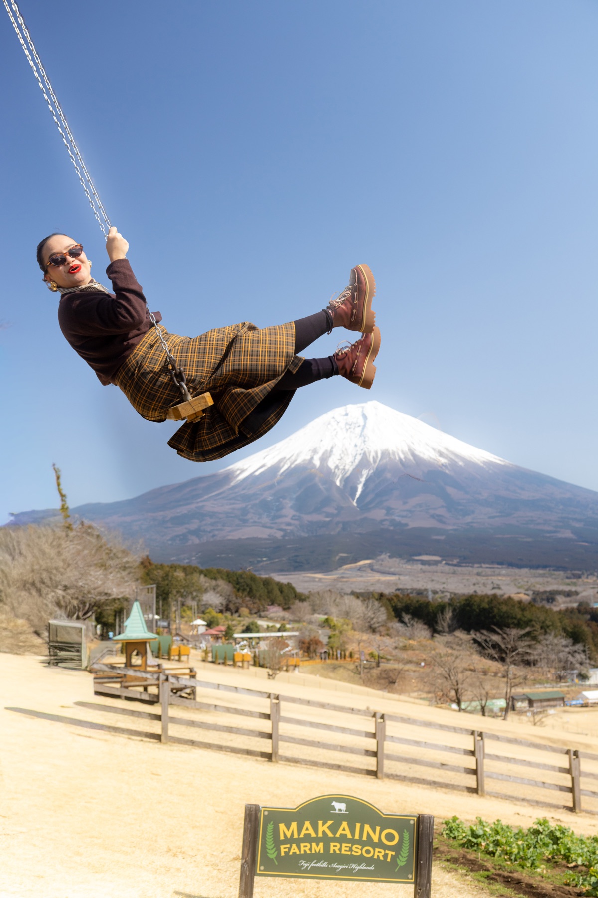 Traveler on swing with Mount Fuji view